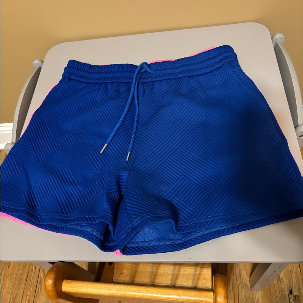 1 Blue and 1 hot pink Women's Shorts. Sold as one.